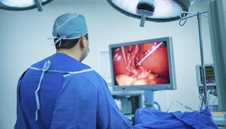 A surgeon performing a laparoscopic operation.