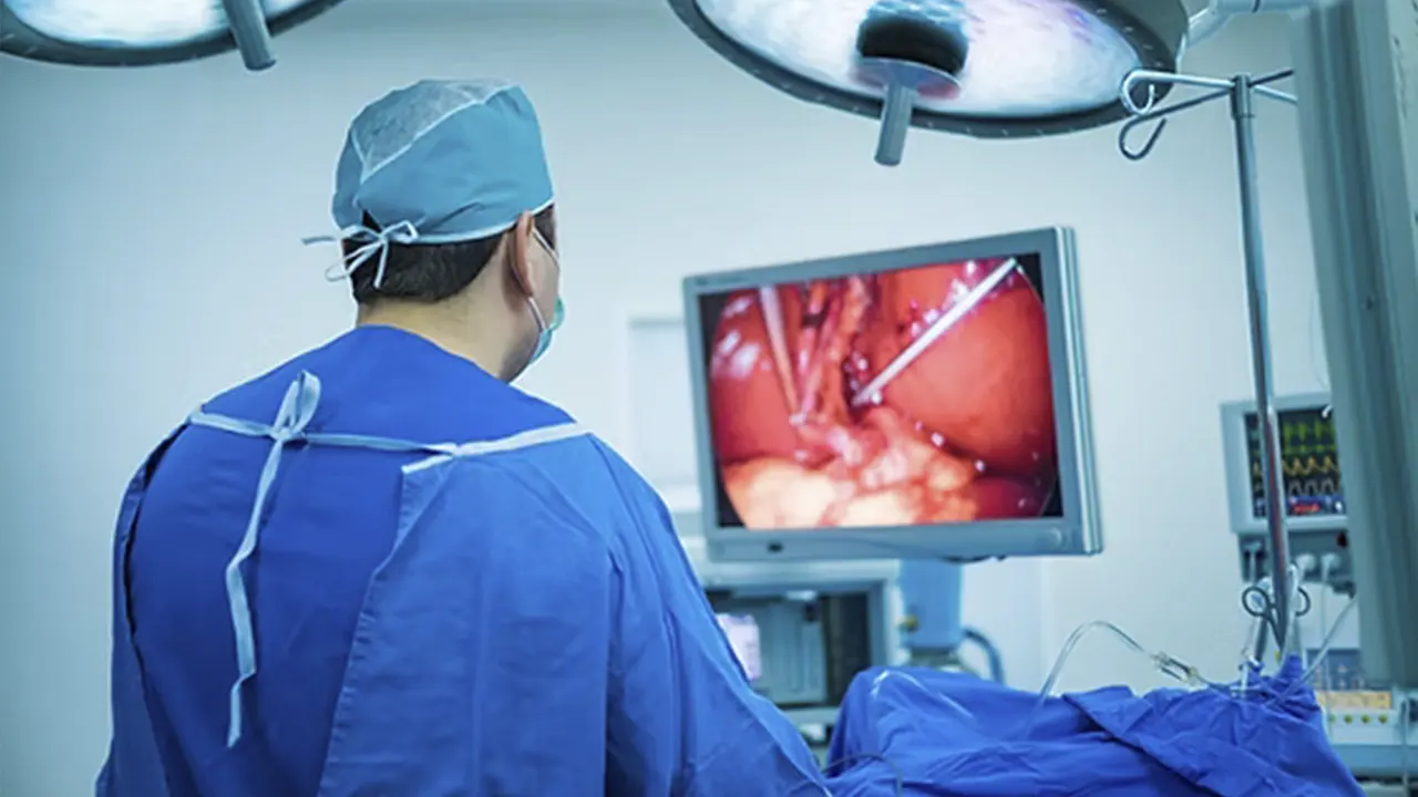 A surgeon performing a laparoscopic operation.