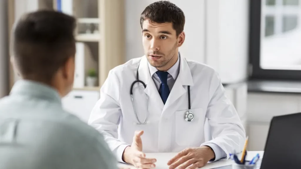 A patient explaining his health condition before a laparoscopic procedure.
