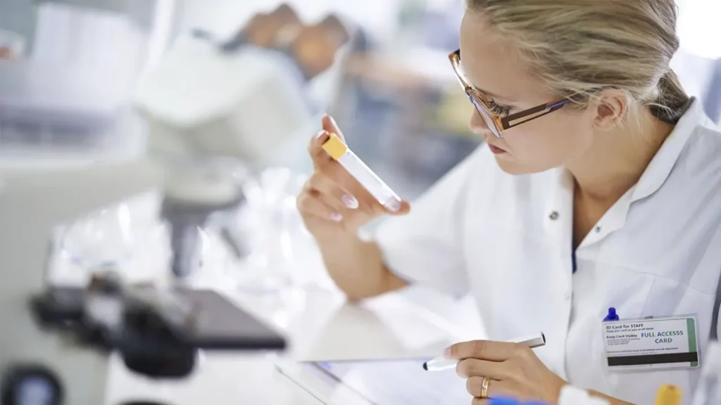 A laboratory technician performing a test