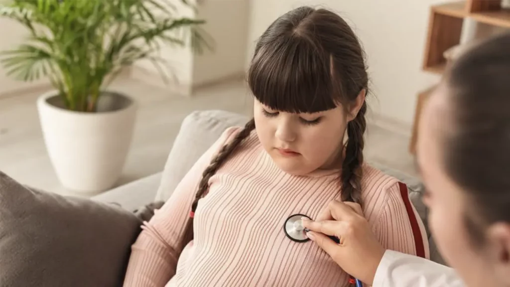 Obese girl being examined by a doctor