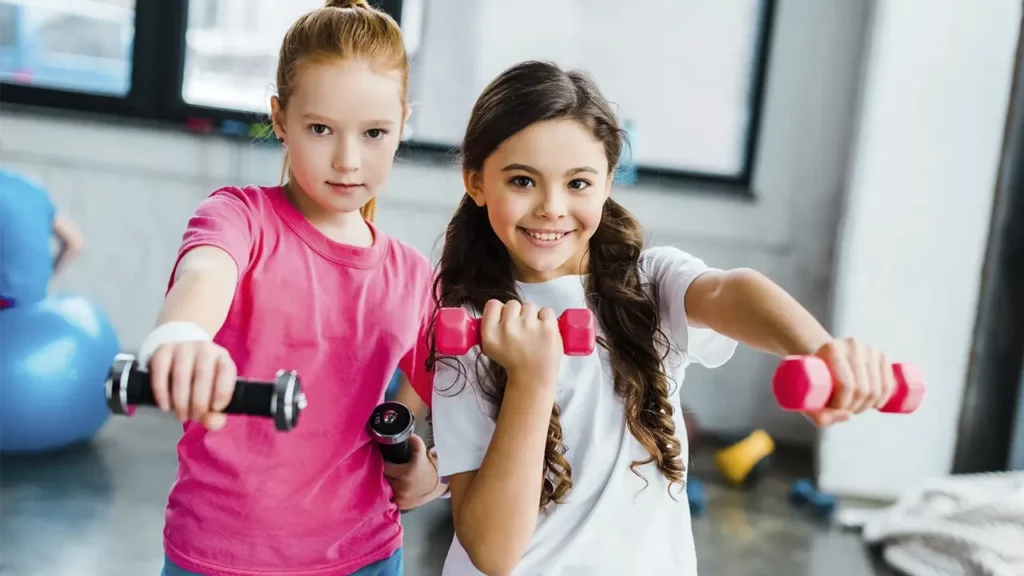 Two little girls exercising