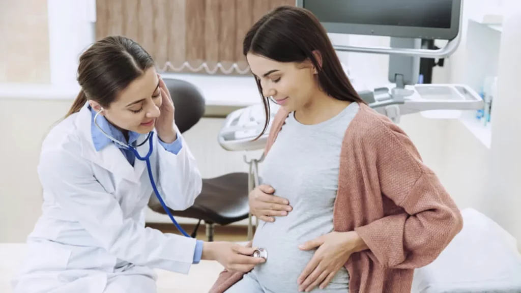 Pregnant woman being examined by a gynecologist