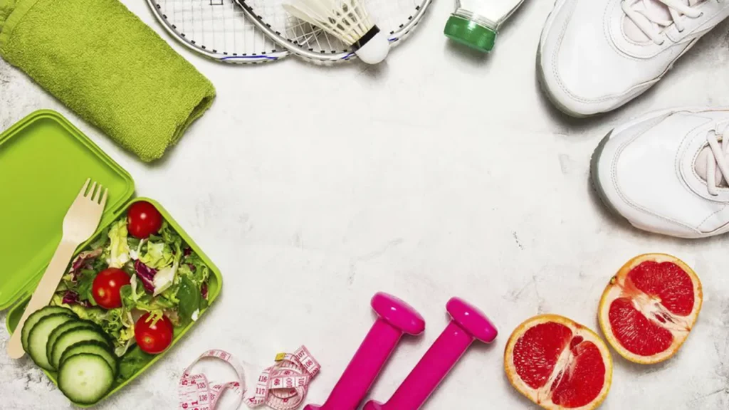 A photo depicting a healthy lifestyle including sneakers, weights, and...