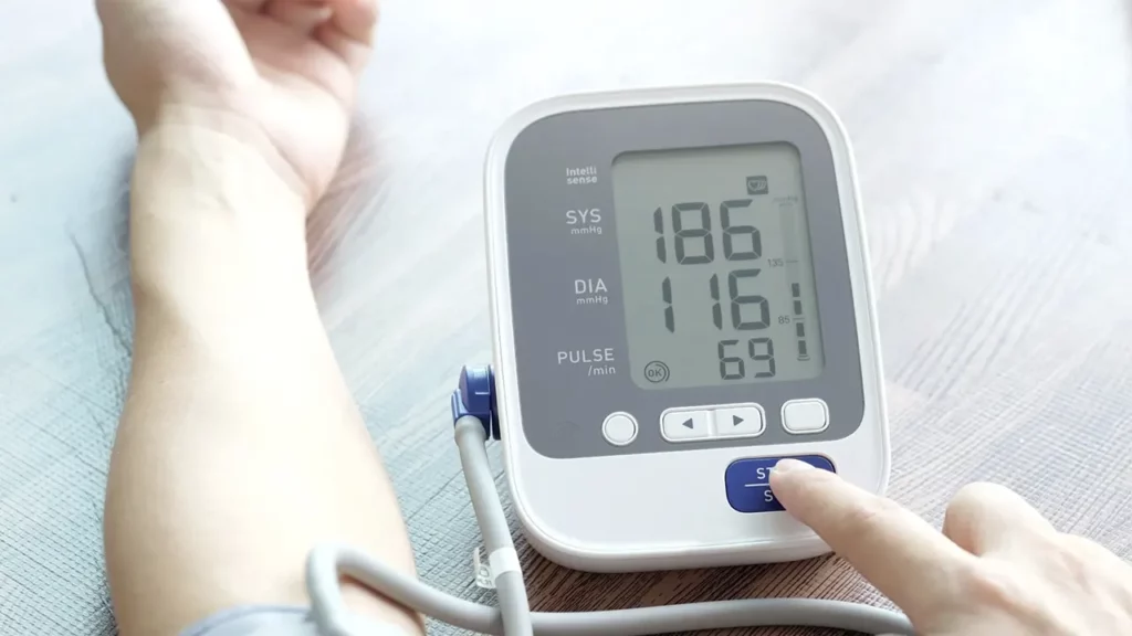 A man measuring his blood pressure.