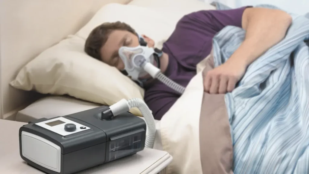 Obese man sleeping with an apnea treatment device